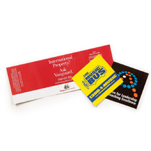 A set of three vinyl stickers in red, yellow, and black, featuring various designs and a logo.