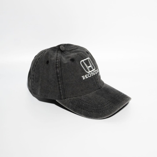 A black denim cotton baseball cap with a logo on the front and a curved brim.