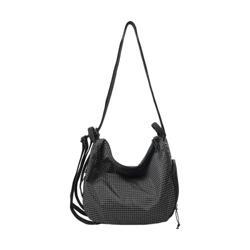 A convertible lightweight backpack duffel bag in black with a grid pattern and multiple straps.