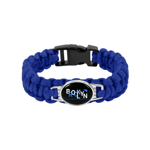 A blue braided paracord bracelet featuring a themed pendant with a black and silver design, complete with a clasp.