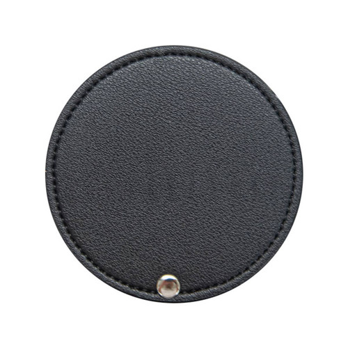 A round black makeup mirror with a stitched edge and a metal snap closure. It features a logo on the surface.
