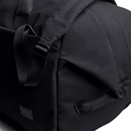 A black duffel bag featuring adjustable straps and a sleek design, with a logo on the side.