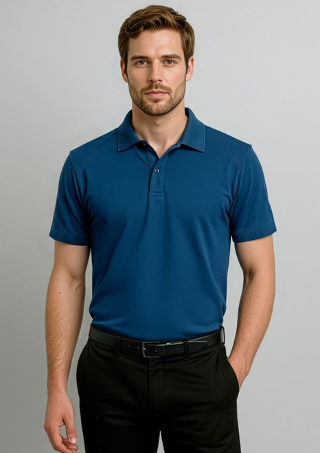 A short-sleeve polo shirt in navy blue, featuring a collar and a logo, worn by a man against a grey background.