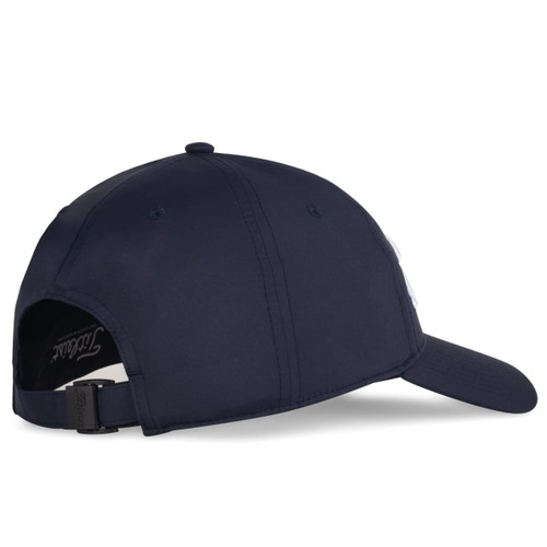 A navy cap with a structured design, featuring a logo and an adjustable strap at the back.