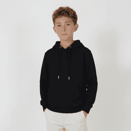 A black Youth Base Hood worn by a young boy, standing against a light background. The hoodie features a drawstring.