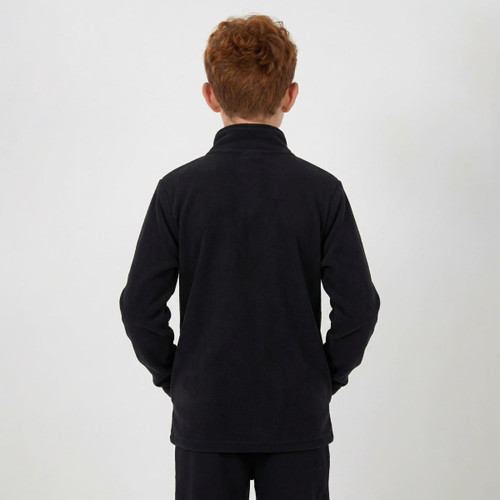 A child wearing a black polar fleece 1/4 zip top, viewed from the back with hands in pockets.