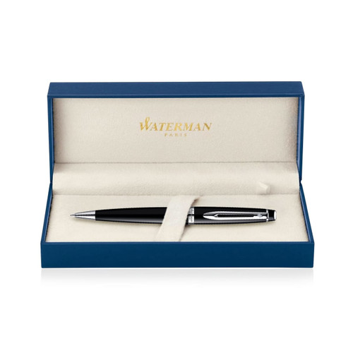 A black lacquer ballpoint pen displayed in a blue box with a soft interior. The box features a branding logo.