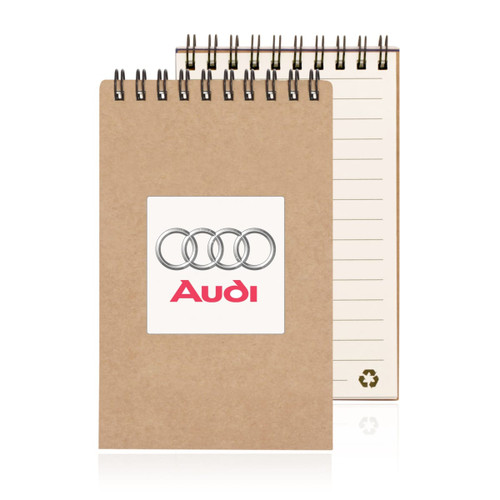 A spiral-bound notepad in a brown recycled cover with lined pages and a logo on the front.