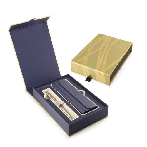 A brushed stainless steel ballpoint pen in a blue box, accompanied by a matching blue case. The box features branding.