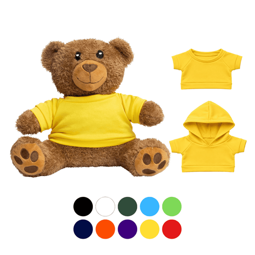 A plush teddy bear in brown with a yellow T-shirt, accompanied by interchangeable outfits in various colours.