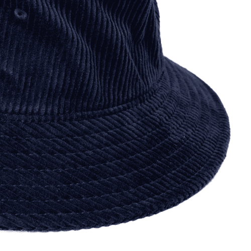 A navy cord bucket hat featuring a textured fabric and a wide brim. The hat includes a branding logo.