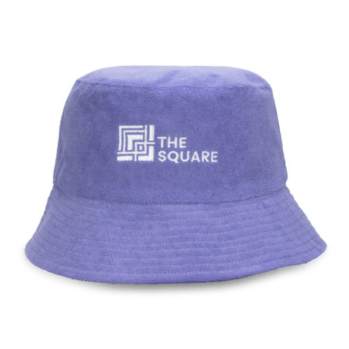A purple reversible twill/terry bucket hat featuring a logo on the front.