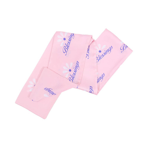A pink chiffon long scarf with white floral designs and the word "Blessings" printed on it. It has a brand logo.