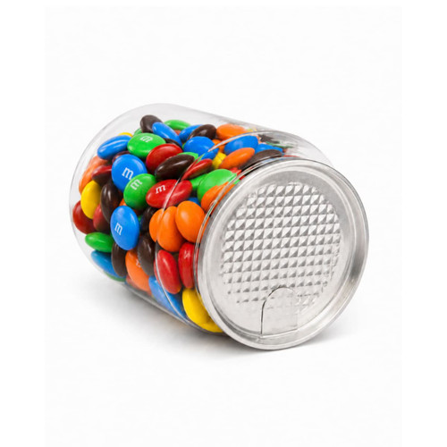 A clear canister filled with colourful M&M's, including blue, green, yellow, red, orange, and brown candies.
