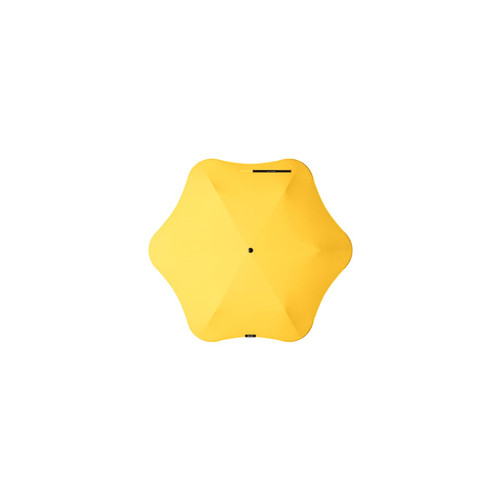 A yellow BLUNT Neo Umbrella with a unique star-shaped design and a central black button.