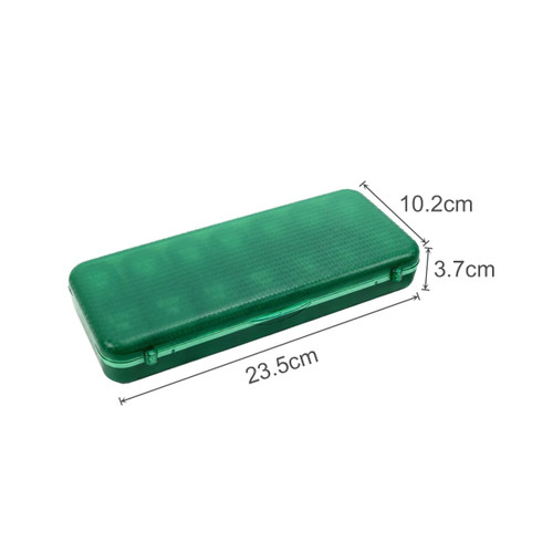 A green, rectangular pills organiser with a translucent lid and measurements of 23.5 cm by 10.2 cm by 3.7 cm.