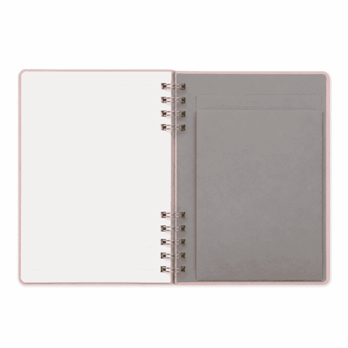 A Twin-Spiral PU hardcover notebook featuring lined pages and a grey pocket on the inside cover, with a soft pink exterior.