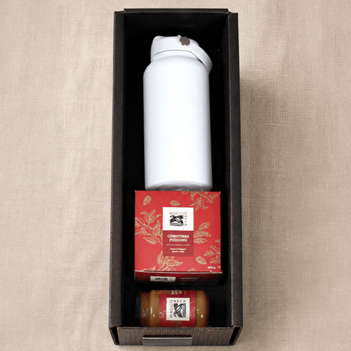 A white drink bottle, Christmas pudding box, and a small jar in a black gift box.