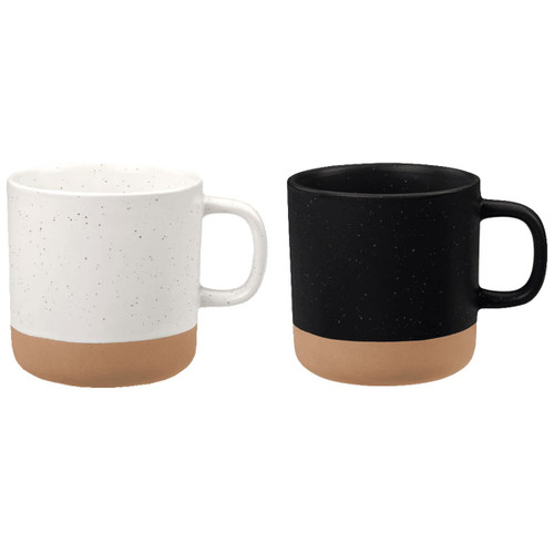 A set of two artisanal ceramic coffee mugs, one white with speckles and a tan base, and one solid black with a tan base.
