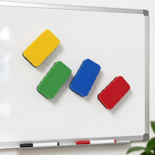 Four magnetic foam whiteboard erasers in yellow, green, blue, and red are attached to a whiteboard.