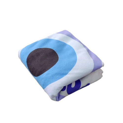 A folded round beach towel featuring blue, black, and white design elements, with a logo present.