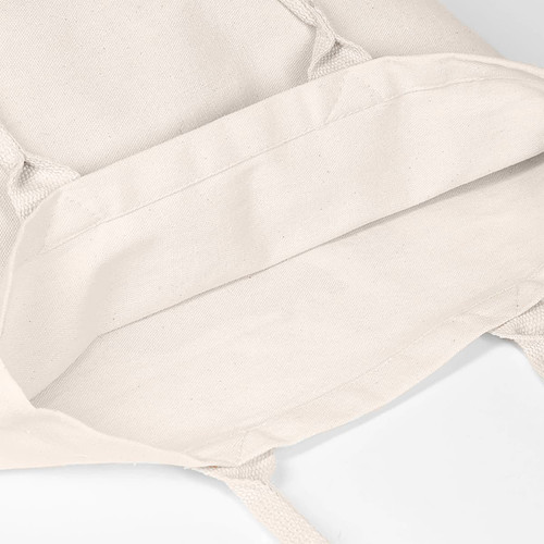 A beige tote bag with no gusset, featuring interior seams and soft fabric. It has a logo and long handles.