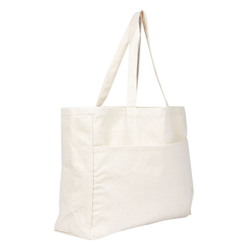 A large beige tote bag with two long straps and a front pocket, featuring a logo.