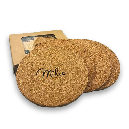 A set of four round cork coasters in a natural colour, packaged with a box featuring a logo.