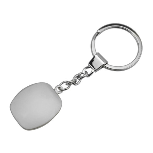 A metallic key ring with a smooth, white cubic pendant attached by a chain.