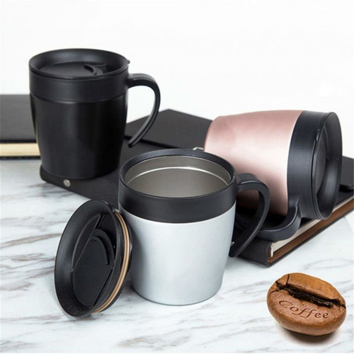 A set of three insulated coffee mugs in black, silver, and rose gold with lids, placed on a marble surface.