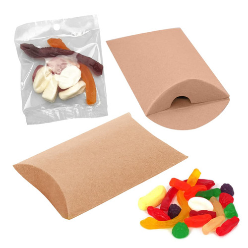 A pillow-shaped package containing assorted jelly lollies in various colours, accompanied by additional lollies on a surface.