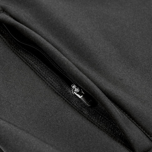 A close-up of a black softshell jacket featuring a zippered pocket and sleek fabric texture.
