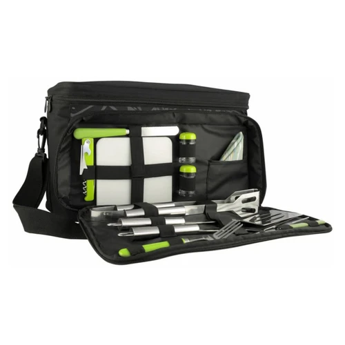 A black picnic bag with green accents, containing utensils, a cutting board, drink bottles, and a napkin.