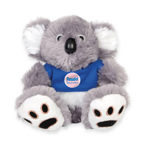 A grey plush koala with white ears and paws, wearing a blue shirt featuring a logo.