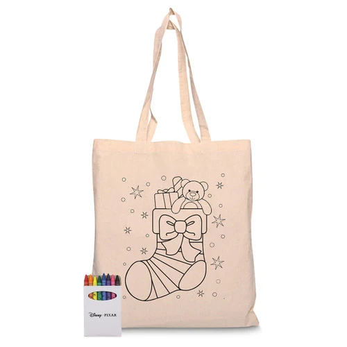 A calico tote bag with a Christmas stocking design and a set of colourful crayons. The bag is beige in colour.
