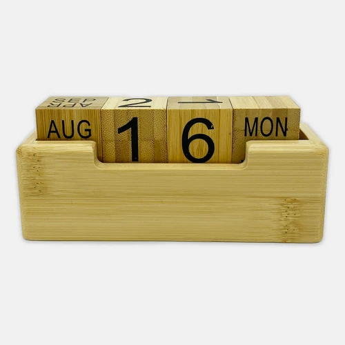 A bamboo perpetual calendar with wooden blocks displaying the date and month, housed in a rectangular base.