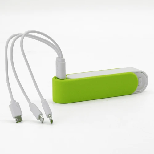 A green and white Slider Power Bank with integrated cables for charging devices.