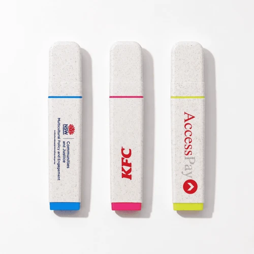 Three highlighters in biodegradable casing: blue, pink, and yellow, featuring various logos.