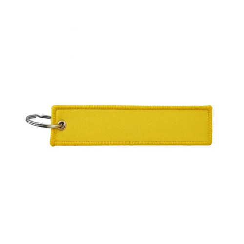 A yellow woven keytag with a metal ring for attaching keys. It has a simple, rectangular design.