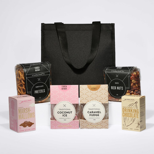 A black cooler bag filled with pretzels, beer nuts, and assorted sweet treats including coconut ice, caramel fudge, and marshmallows.