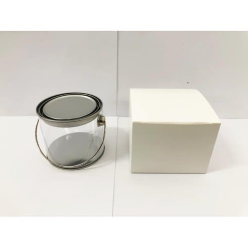 A medium clear PVC bucket with a metal handle next to a plain white box.