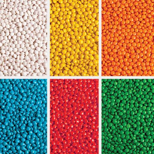 A collection of brightly coloured chewy fruit candies in six sections: white, yellow, orange, red, blue, and green.