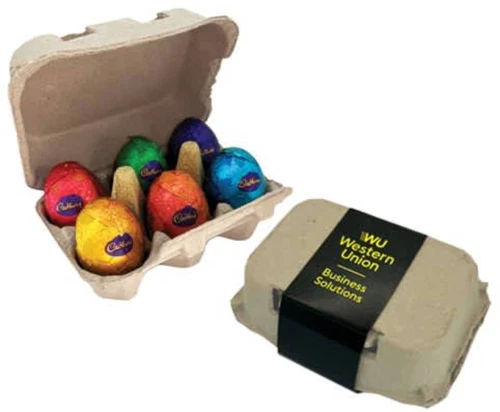 A carton containing six chocolate eggs in vibrant foil wrappers, with an accompanying branded packaging.