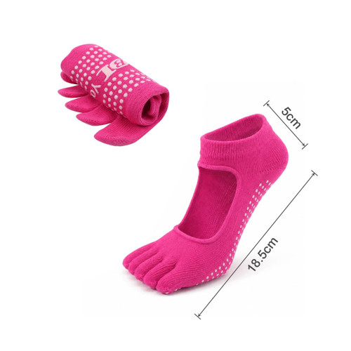 Open top yoga toe socks in bright pink, featuring individual toe pockets and non-slip grip dots.