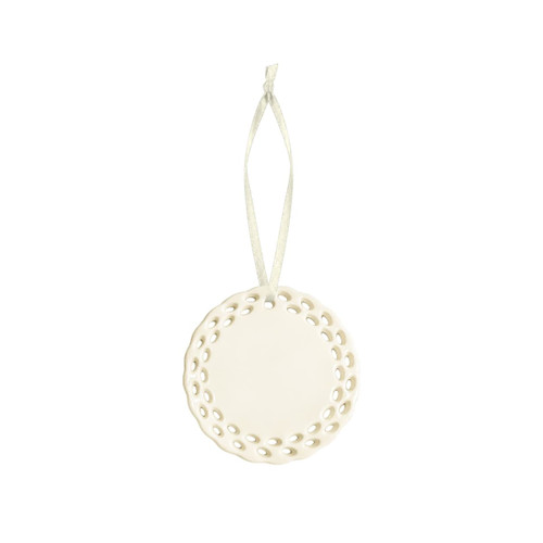 A ceramic ornament in white with a decorative perforated edge and a hanging ribbon.