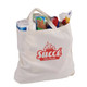 A cream-coloured calico bag with a gusset, filled with various grocery items, featuring a logo.