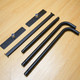 Black metal parts for a Sidewalk Cafe Barrier, including straight and curved poles with base plates.