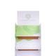 A white cardboard floor display with green accents and a logo at the top, featuring three shelves for products.