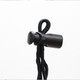A black toggle and cord for securing items, featuring a rounded end and adjustable design.
