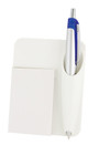 A white car air vent note pad and pen holder featuring a silver pen and a square notepad. It has a logo on the surface.